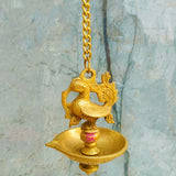 Antique-style brass hanging diya with decorative chain, designed for temple worship, spiritual decor, and traditional Indian homes.