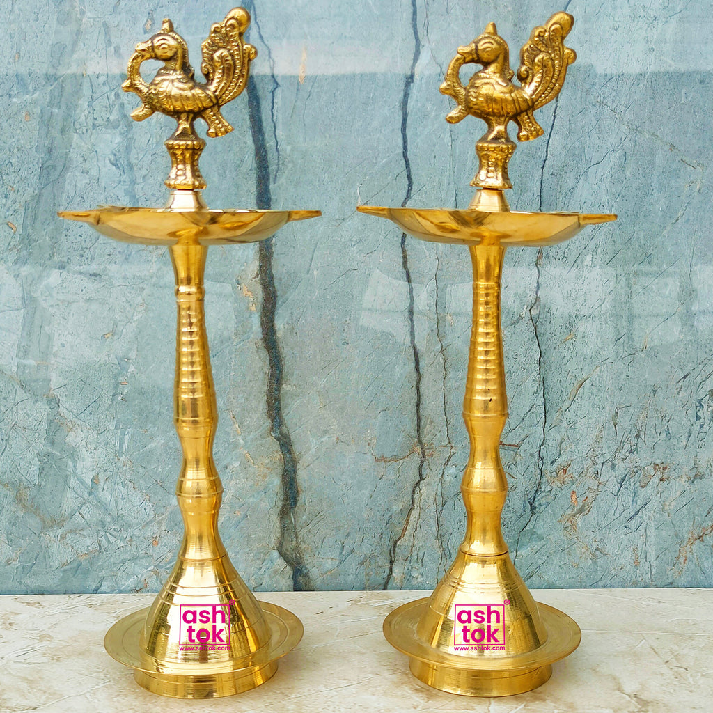Antique brass peacock oil lamp set of 2 with intricate detailing, ideal for temples, prayer rooms, and decorative displays.