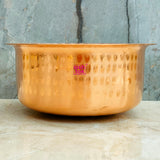 Artisan-crafted copper patila with elegant hammered design, ideal for traditional cooking and serving applications.