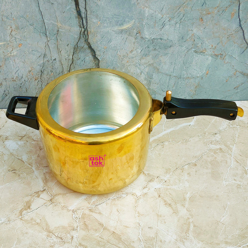 Authentic brass pressure cooker with 5 liter capacity, crafted for safe cooking and long-lasting kitchen performance.