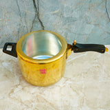 Authentic brass pressure cooker with 5 liter capacity, crafted for safe cooking and long-lasting kitchen performance.