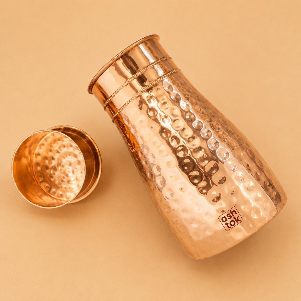 Ayurvedic copper water carafe set featuring a 1 litre bottle and tumbler for healthy hydration and traditional wellness practices.