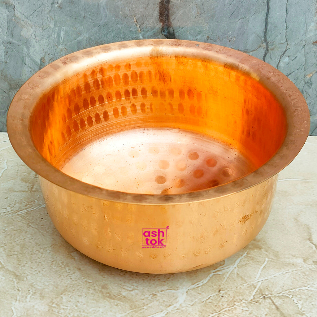 Heavy-duty copper patila tope with hammered texture, suitable for preparing curries, rice dishes, and festive meals.