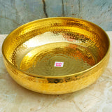 Decorative brass urli bowl with hammered texture, suitable for flower arrangements, floating candles, and festive celebrations.