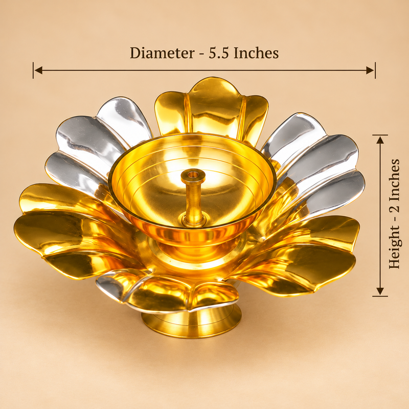 Size guide image of a gold and silver coated brass lotus diya showing an overall diameter of 5.5 inches and a height of 2 inches. The decorative brass oil lamp features alternating golden and silver lotus flower petals, a central polished golden bowl, a raised cotton wick holder, and a circular pedestal base. Dimension arrows indicate the width and height of the diya, helping customers understand its size for home pooja, Diwali decoration, traditional gifting, and religious ceremonies.