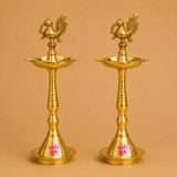 Handcrafted brass peacock deepam set of 2 featuring a traditional antique design, perfect for festive decor and daily worship.