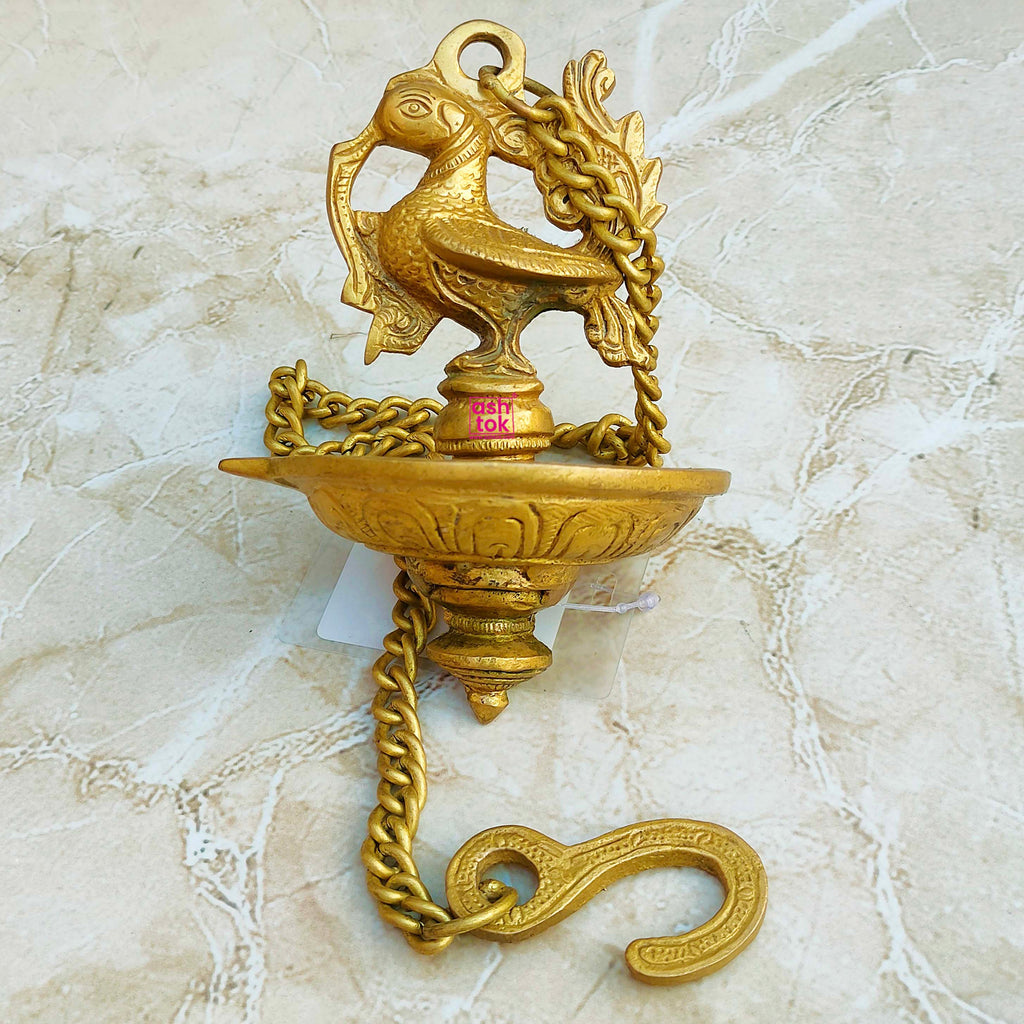 Heritage brass hanging diya handcrafted with chain, perfect for lighting during religious rituals, pooja, and traditional celebrations.