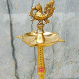 Heritage-style brass peacock deepam set featuring antique finish and traditional design for elegant home and temple decor.