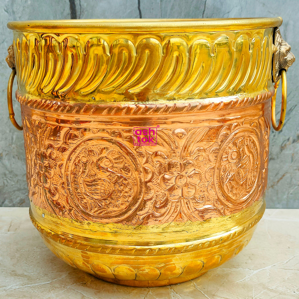 Luxury brass and copper planter pot with decorative finish, perfect for enhancing indoor and outdoor plant arrangements.