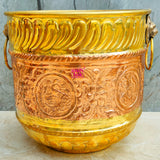 Luxury brass and copper planter pot with decorative finish, perfect for enhancing indoor and outdoor plant arrangements.