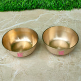 Luxury bronze Kansa bowl set with sophisticated matt finish, perfect for serving traditional Indian cuisine and snacks.