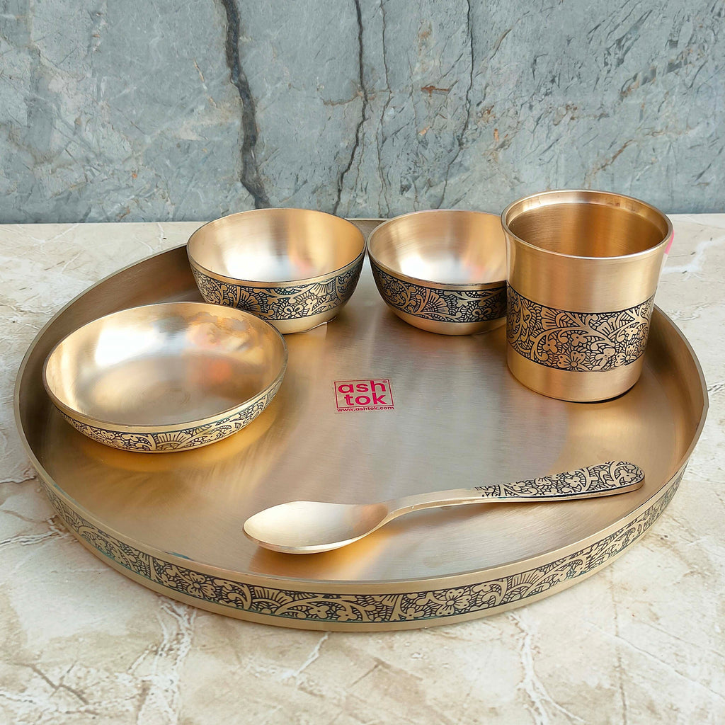 Luxury Kansa bronze dinner set with decorative etching work, crafted for elegant dining, celebrations, and heritage-inspired table settings
