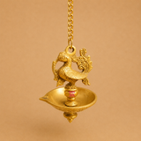 Premium brass hanging diya featuring a sturdy chain, ideal for home temples, pooja rooms, festivals, and devotional ceremonies.