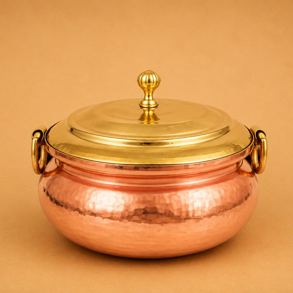 Premium copper biryani handi with brass lid, ideal for authentic dum biryani, slow cooking, and traditional Indian recipes.