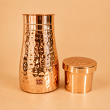 Premium 1 litre copper water carafe with glass, designed for daily hydration, wellness routines, and stylish bedside use.