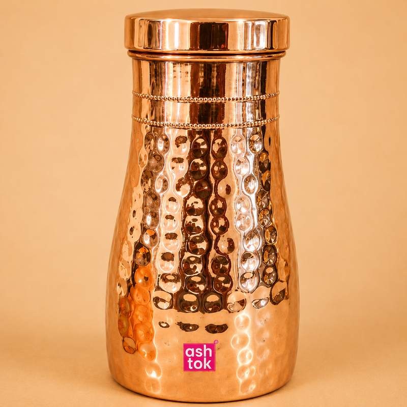 Pure copper bedside carafe with 1 litre capacity and matching glass, ideal for healthy hydration and bedside water storage.