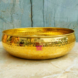 Traditional brass uruli featuring a hammered design, ideal for displaying flowers, candles, potpourri, and decorative accents.
