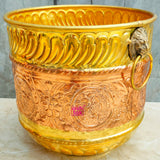 Traditional brass and copper planter suitable for flowers, herbs, and decorative plants in homes, patios, and gardens.