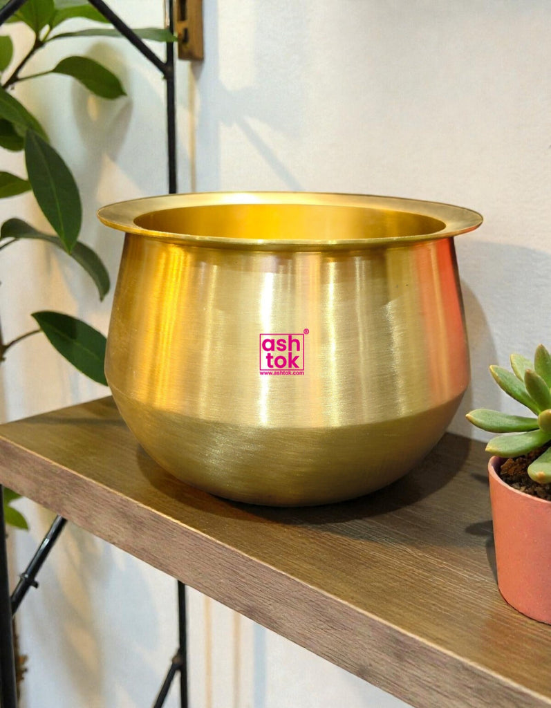 Traditional bronze cooking handi designed for preparing biryani, rice, curries, and festive dishes in Indian kitchens.