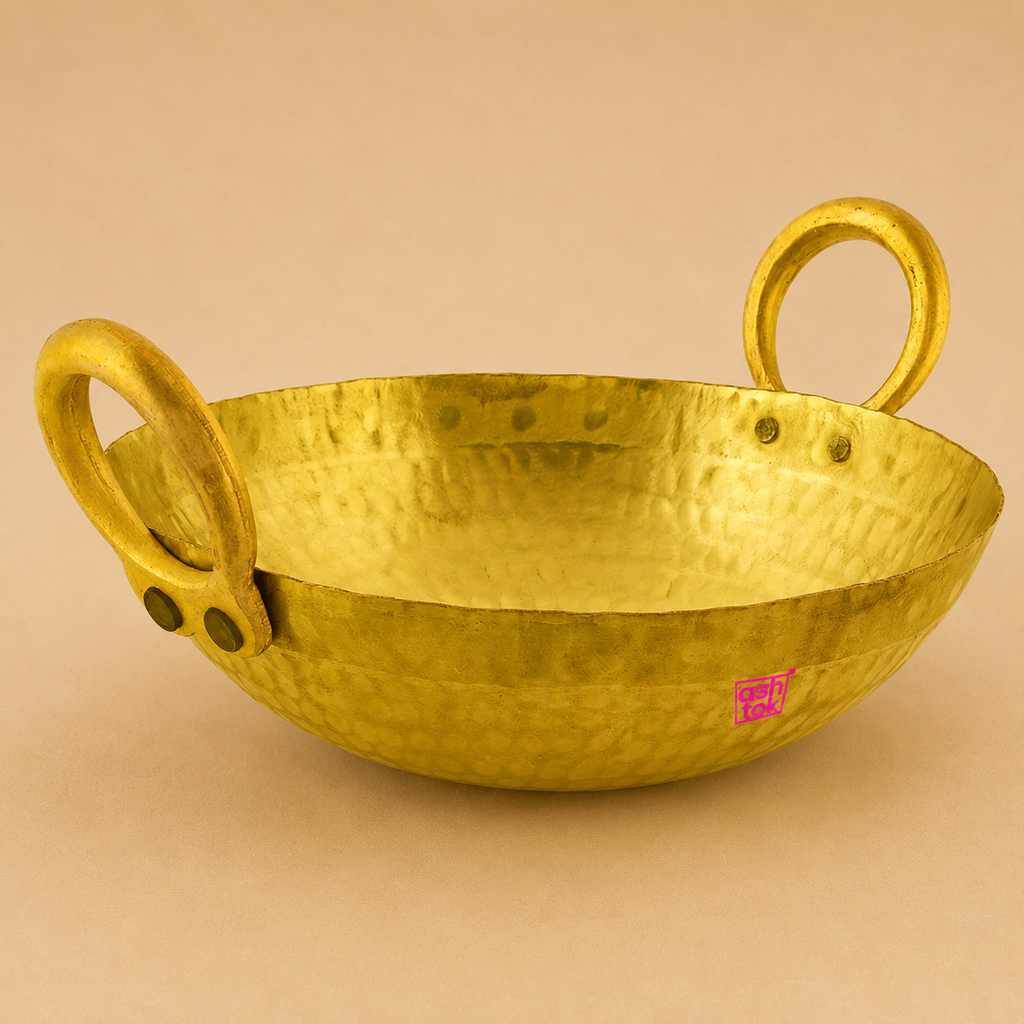 Traditional handmade brass kadai for deep frying, sautéing, and cooking Indian dishes, crafted with durable brass and authentic design.