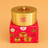 "Alpha cylinder gold metal gift box with decorative embossed lid, perfect for dry fruits, chocolates, festive hampers, wedding gifts, and premium gift packaging."