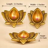 Size guide of a traditional antique brass lotus diya showing its dimensions of 2.5 inches in length, 2 inches in width and 0.5 inch in height. The decorative brass oil lamp features an elongated central teardrop-shaped cavity surrounded by curved lotus petals with engraved detailing and a golden antique finish. Its compact dimensions make it suitable for daily puja, small home mandirs and decorative festive arrangements.