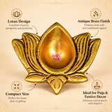 Product features infographic highlighting a traditional antique brass lotus diya with a golden metallic finish, intricately sculpted lotus petals, central teardrop-shaped oil-holding cavity and compact decorative design. The image showcases its antique-style surface texture and floral detailing, making it suitable for daily prayers, Diwali decorations, festive puja arrangements, traditional gifting and home mandir use.