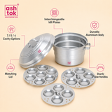 Feature breakdown graphic showing the Ashtok idli steamer with callouts for durable aluminium body, sturdy side handles, matching lid, and cavity options.