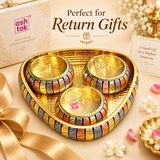 ASHTOK brass gift tray with three decorative lidded bowls presented as a premium return gift, featuring an elegant multi-tone metallic design and pink ASHTOK branding, ideal for weddings, housewarming ceremonies, festive occasions, family functions and celebration gifting.