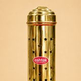 Close-up view of the star-shaped cutouts and shiny golden surface of the Ashtok brass incense holder tower.