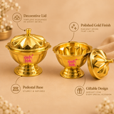 Product features diagram for the Ashtok brass kumkum box, showing two polished gold-finished brass containers on a neutral background—one fully closed with a fluted decorative lid and top finial, and one open with the lid removed. Feature callouts highlight its decorative lid, radiant polished finish, sturdy pedestal base, and giftable design for special occasions.
