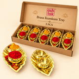 ASHTOK brass kumkum tray 5 pieces gift box containing five polished brass leaf-shaped trays with dual haldi and kumkum bowls, designed for pooja ceremonies, festive occasions, wedding gifting and traditional return gifts.