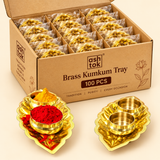 ASHTOK brass kumkum tray 100 pieces bulk packaging image showing multiple leaf-shaped brass haldi kumkum tray sets packed inside a box, with two round bowls per set for kumkum and turmeric, suitable for wholesale, wedding and festive bulk orders.