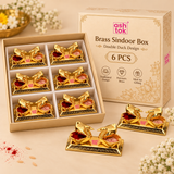 Pack of 6 image of Ashtok brass sindoor box double duck design showing six decorative brass sindoor boxes in compartment packaging with Ashtok branding, ideal for gifting, pooja use, return gifts, and festive occasions.