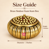 Size guide image of ASHTOK brass sindoor kum kum box showing diameter 3 inches and height 2 inches, with the decorative brass box displayed on a beige background.