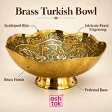 Feature image of the Ashtok Brass Turkish Bowl highlighting its decorative scalloped rim, detailed floral engraving, polished brass finish and stable raised pedestal base, presented on a soft beige background with ASHTOK branding. The close product presentation emphasizes the traditional floral and foliage patterns decorating the inner surface, the rich golden appearance of the brass body and the balanced pedestal construction, making this bowl an elegant combination of decorative craftsmanship and practica