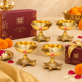 Bulk gifting image of decorative brass diyas with turtle bases, arranged in an elegant festive setup to highlight their use as return gifts, festive gifting items, and traditional celebration favors.