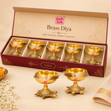 Pack of 5 brass diyas with turtle bases presented in a box-style gifting display, suitable for festive gifting, pooja return gifts, and traditional home decor collections.