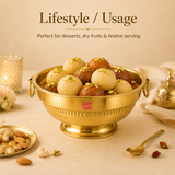 Ashtok brass urli bowl filled with gulab jamun and rasgulla sweets, displayed in a festive lifestyle serving setup with nuts and a brass spoon.