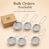 Bulk order promotional graphic displaying six Ashtok stainless steel tea strainers arranged next to a branded cardboard packaging box.