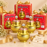 Festive bulk gifting image featuring the Ashtok chocolate box surai displayed as a premium return gift and gifting collection on a beige background. The composition highlights the ornamental storage jars alongside a coordinated gifting presentation, emphasizing their suitability for event gifting, festive giveaways, wedding return gifts, corporate gift packs, and celebration hampers. Each surai jar showcases a rounded ribbed gold-brass body, a polished copper-toned lid, and a crystal-style top knob for a ri