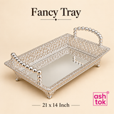 Ashtok German silver fancy tray in 21 x 14 inch size shown on a beige background, presenting a larger rectangular serving tray with ornate filigree framework, elegant silver polish, decorative beaded handles, raised ornamental feet, and a mirror-finish base, ideal for grand festive setups, luxury gift hampers, dry fruit presentation, sweets serving, wedding gifting, and statement tabletop display.