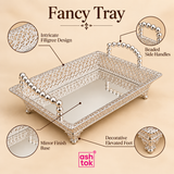 Detailed craftsmanship image of the Ashtok German silver fancy tray with focus on the ornate filigree side pattern, refined metalwork, elegant border finishing, bead handle structure, and mirror-like inner base, presented on a beige background to showcase the premium decorative quality of this German silver gift item for festive use, elegant presentation, and home décor styling.