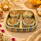 Lifestyle image of the Ashtok Gift Bowls Tray set arranged in a festive setting, with the decorative bowls filled with almonds, cashews, raisins, and mukhwas, showing its use for serving dry fruits, snacks, and mouth fresheners during special occasions.