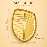 Size guide graphic for Ashtok golden leaf tray indicating 7.5 inches length, 6 inches breadth, and 1 inch height dimensions.
