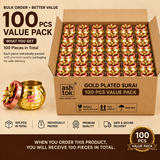 Product promotional graphic for Ashtok Gold Plated Surai featuring a 10 Pcs Value Pack. On the right, an open cardboard shipping box neatly displays 10 hammered metallic gold-plated surai jars arranged in two rows of five, each fitted with a copper-red lid topped with a gold floral handle. To the left, a single gold surai jar is shown alongside its detached copper-red lid with the Ashtok brand logo visible. Text overlays read "BULK ORDER • BETTER VALUE", "10 PCS VALUE PACK", and specify details such as "10 