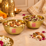 ASHTOK hammered brass bowls displayed in an elegant festive setting with dry fruits, nuts and mukhwas, showcasing the polished golden brass finish and traditional hammered texture for premium home serving and entertaining.