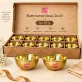 ASHTOK hammered brass bowl pack of 10 image showing ten polished brass katoris neatly packed in individual compartments inside a premium box, with sample bowls displayed outside for gifting, wholesale, festive and bulk orders.