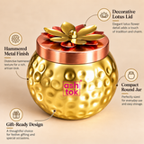 ASHTOK hammered gold-tone dry fruit jar with decorative lotus lid, compact round shape and gift-ready design