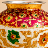 Close-up of ASHTOK Meenakari ghada showing detailed red gold white and green floral artwork